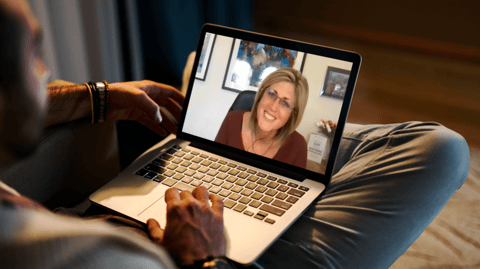 mockup-of-a-man-using-a-macbook-in-a-cozy-living-room-2324-el1 (1)-2